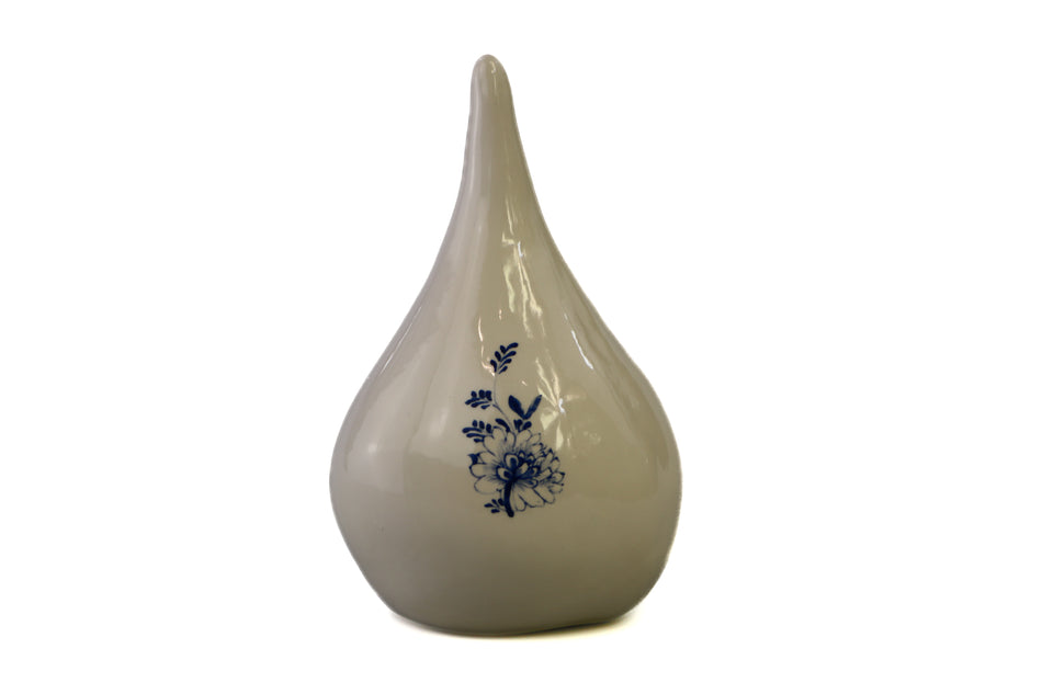 White drop urn with delphinium blue flower Beige